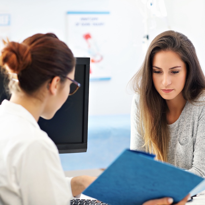 a woman consults her gynaecologist in Hong Kong about her health issues