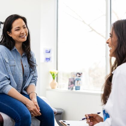The mid adult woman sees her female gynaecologist in Hong Kong for her yearly well-woman check-up.