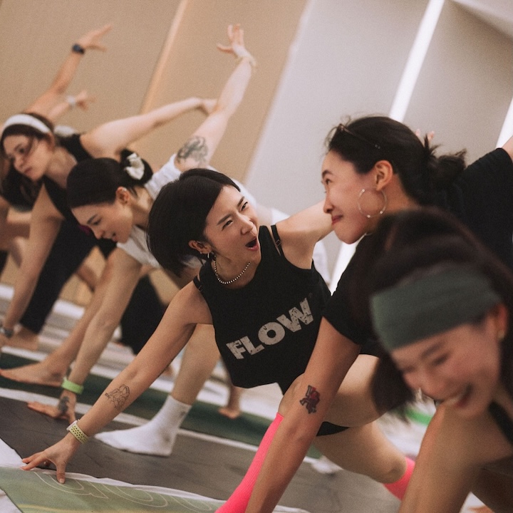 group of women from inside flow hong kong doing yoga together this weekend