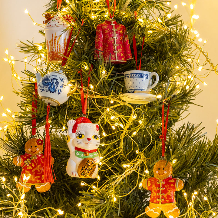 christmas decorations on a tree from The Lion Rock Press in Hong Kong, festive decor from the lion rock press hand painted glass decorations hanging ornaments and more