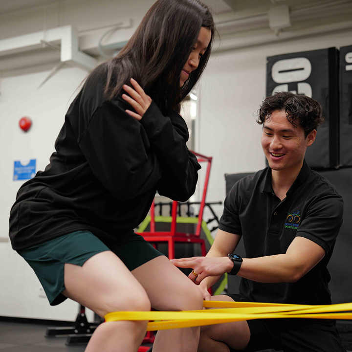 woman doing exercises with her physiotherapist at Hong Kong Sports Clinic division of Total Health