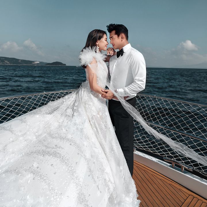 couple on their wedding day on a boat, photographed by Taptsov Production