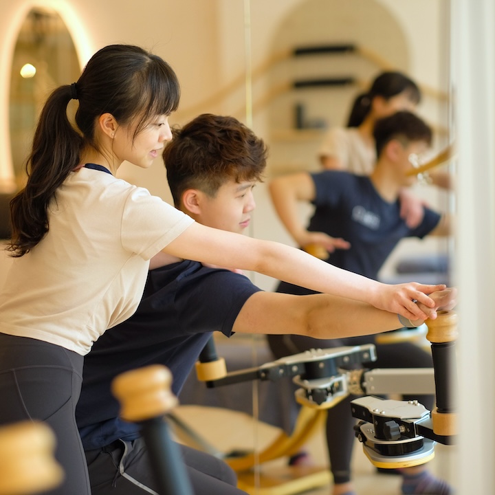 woman Physiotherapist leading a one-on-one Pilates and Gyrotonic Session in Tsim Sha Tsui, Hong Kong